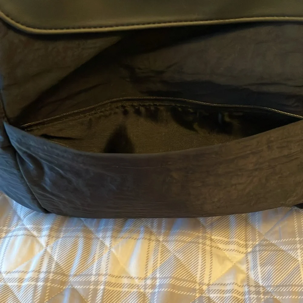 On the go backpack by Thirty-One. New in bag. Butterfly embroidered on flap